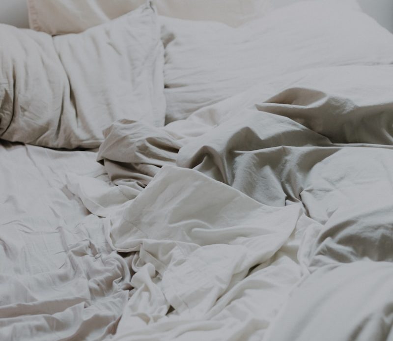 white pillows and bed comforter